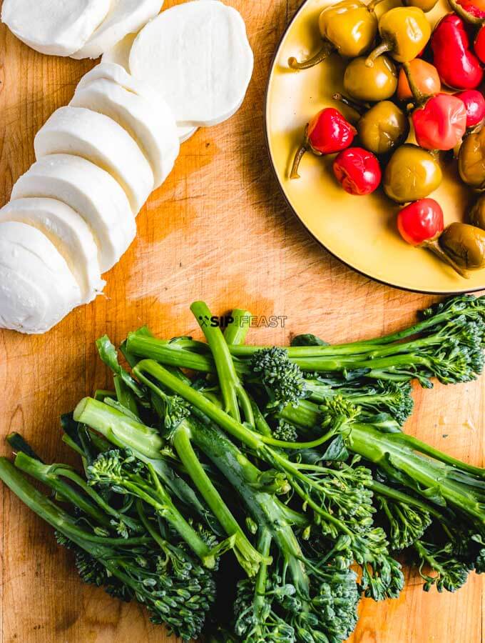 Fresh mozzarella, broccolini, and cherry peppers. Ingredients for the roasted broccolini sheet pan dinner.