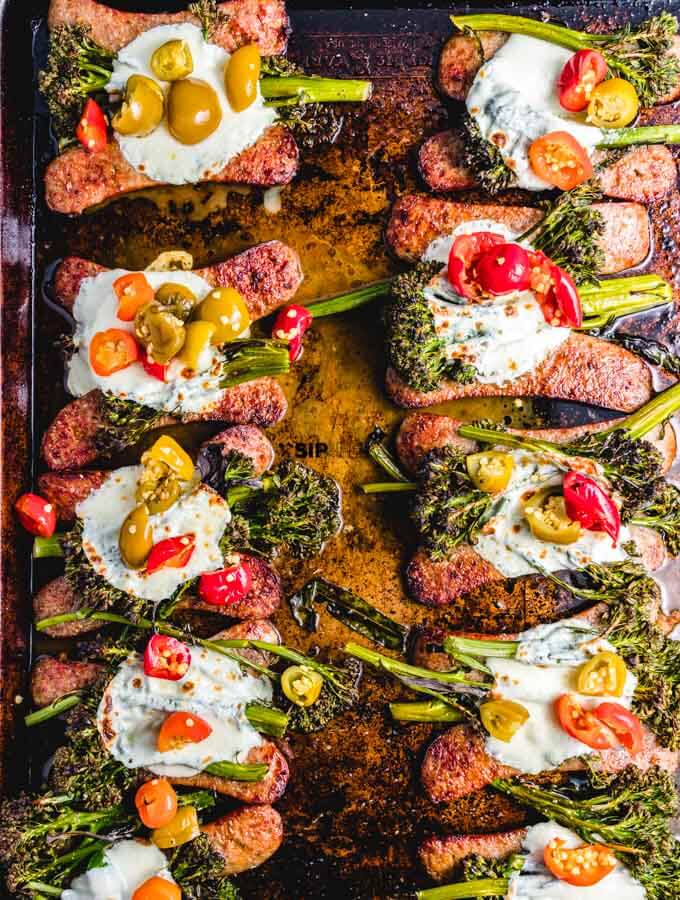 The final shot of the roasted broccolini sheet pan dinner with Italian sausage, fresh mozzarella, and cherry peppers.