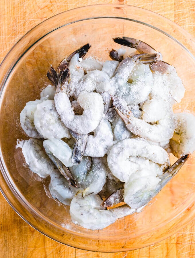 Spanish Shrimp Tapas With Chorizo And Lemon. Super flavorful and easy appetizer recipe. #sipandfeast #appetizers #chorizo The shrimp with baking soda added.