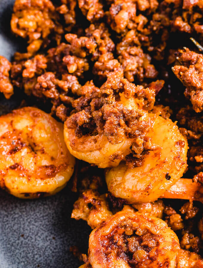 Plating of the Spanish Shrimp Tapas With Chorizo and Lemon.