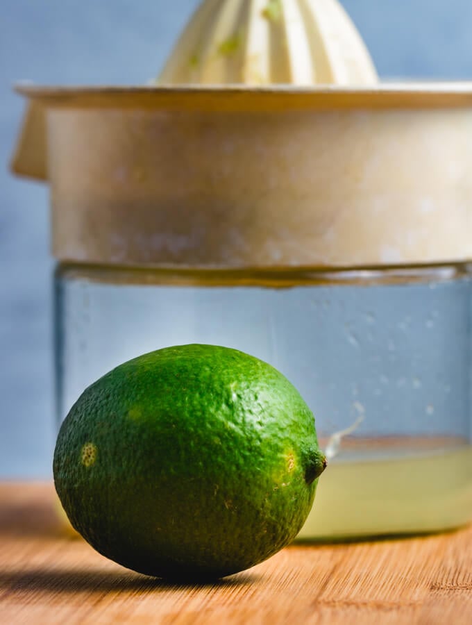 Fresh lime juice and juicer picture.