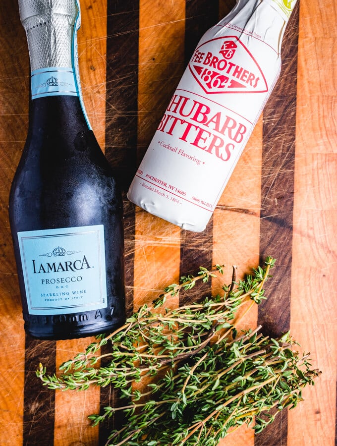 The prosecco, rhubarb bitters, and fresh thyme for the sparkling cocktail.