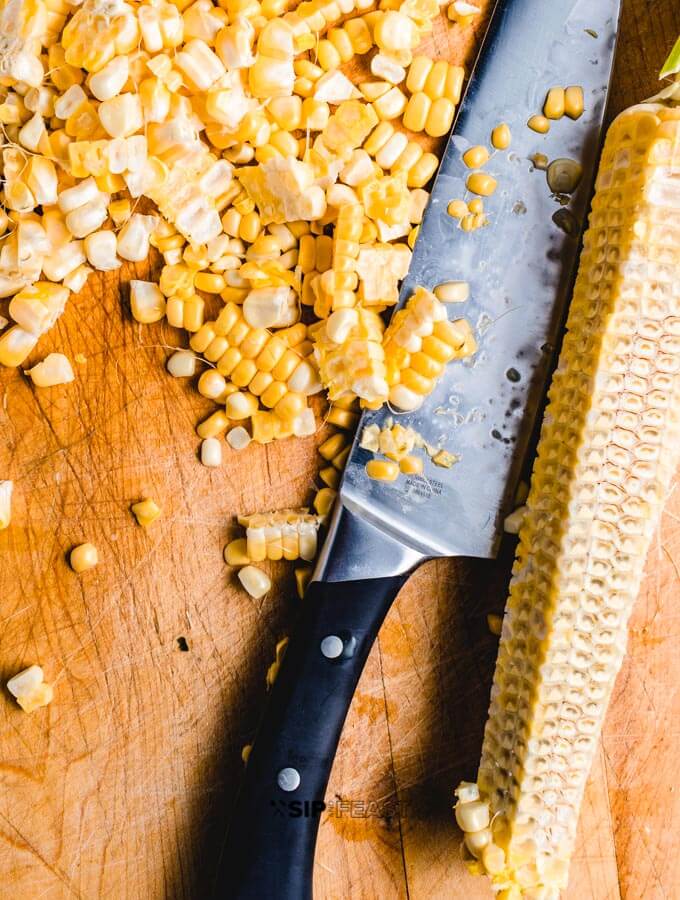 Cut corn kernels for the Mexican street corn salad. 