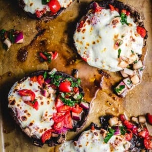 Baked portobello mushrooms with bruschetta and mozzarella