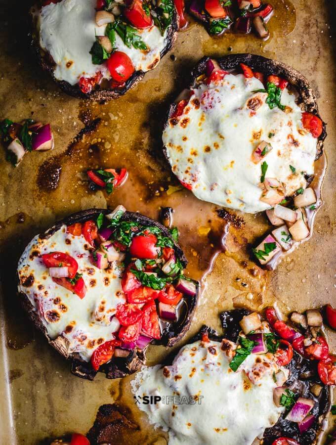 Baked portobello mushrooms with bruschetta and mozzarella featured image.