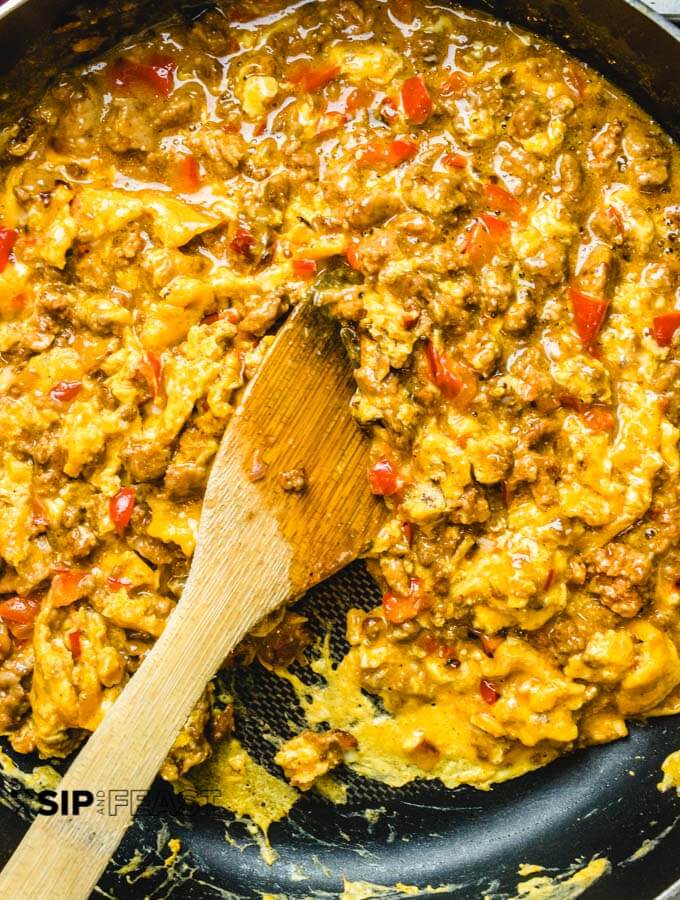The chorizo and eggs are almost finished cooking in the pan.