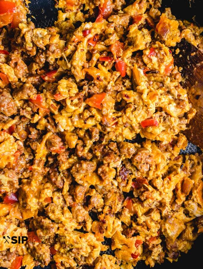 Chorizo and eggs finished cooking in pan.