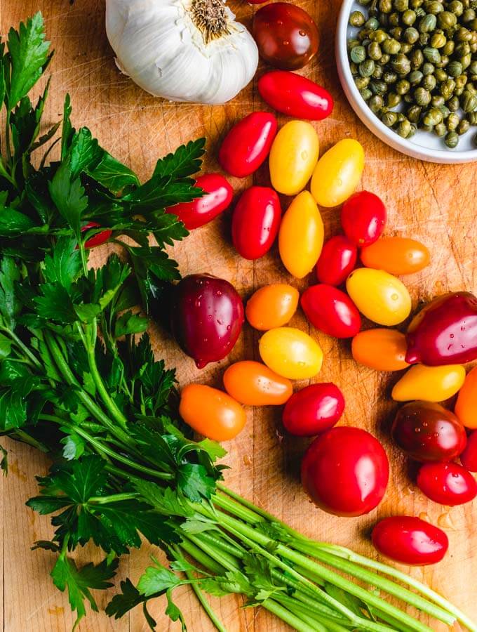 Tomatoes, parsley, garlic, and capers for the Italian chicken with capers and cherry tomato sauce.