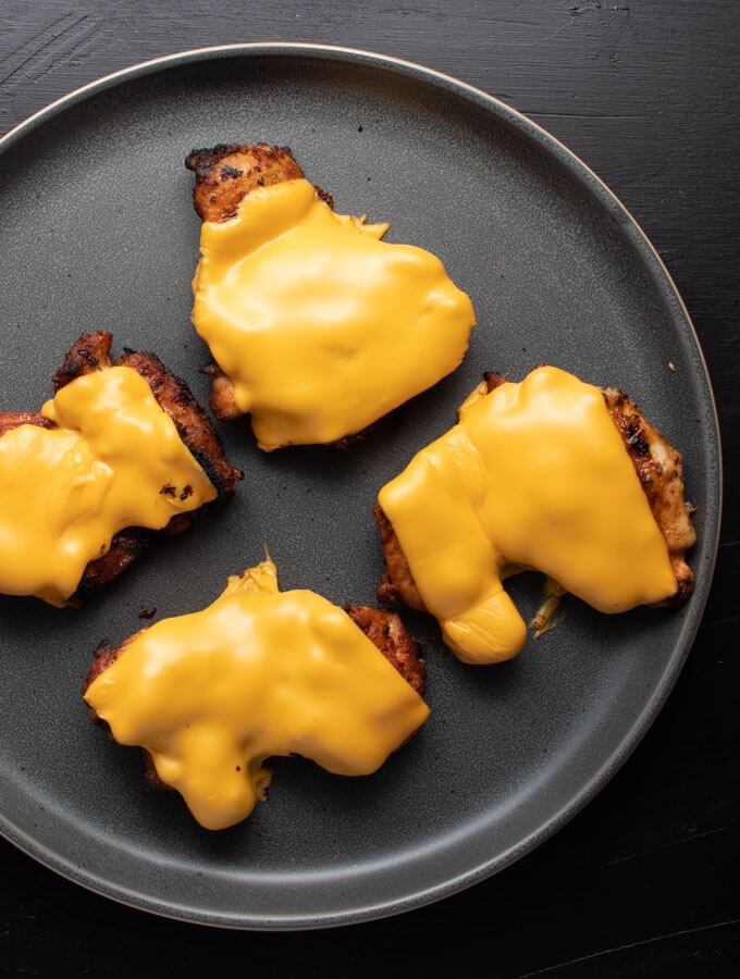 Cheese on the blackened chicken thighs.