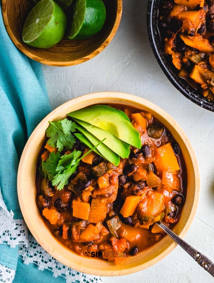 Overhead shot of the chili with limes on the side.