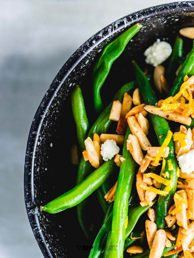 Close up shot the Green beans almondine with feta.