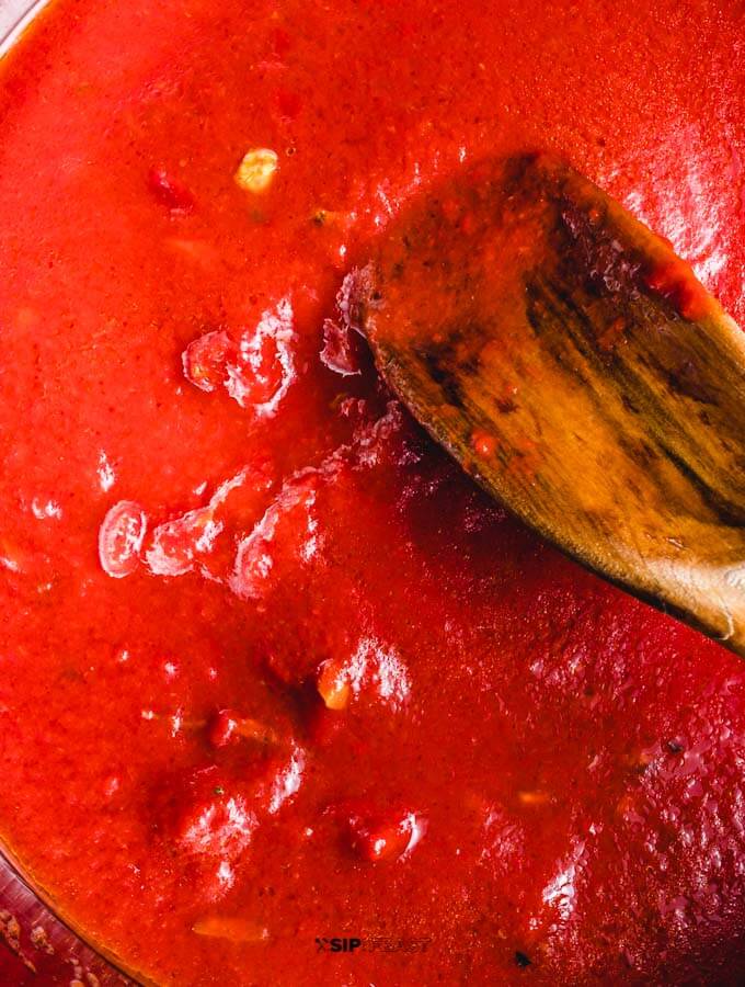 Tomato paste added to the pan.