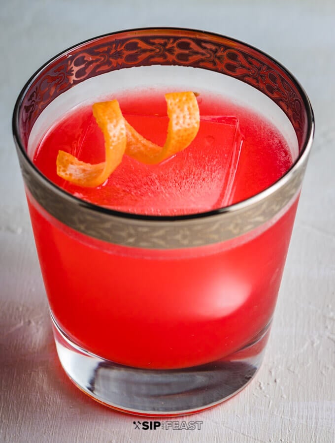 Glass of Grapefruit Gin Cocktail with twist of Grapefruit peel