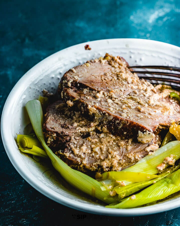 Milk braised pork shoulder and leeks plated.