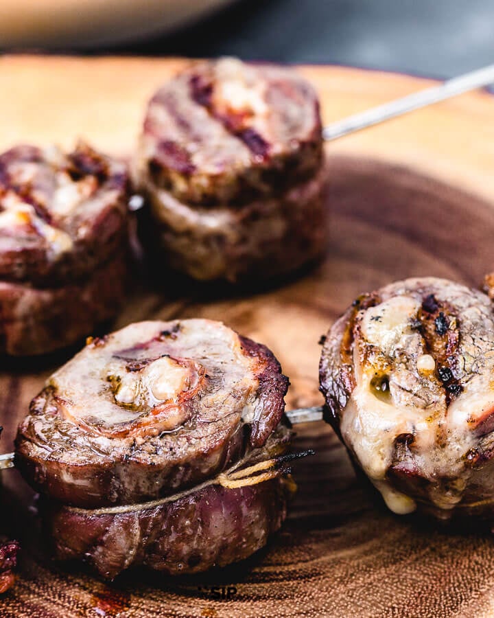 Steak pinwheels on cutting board.