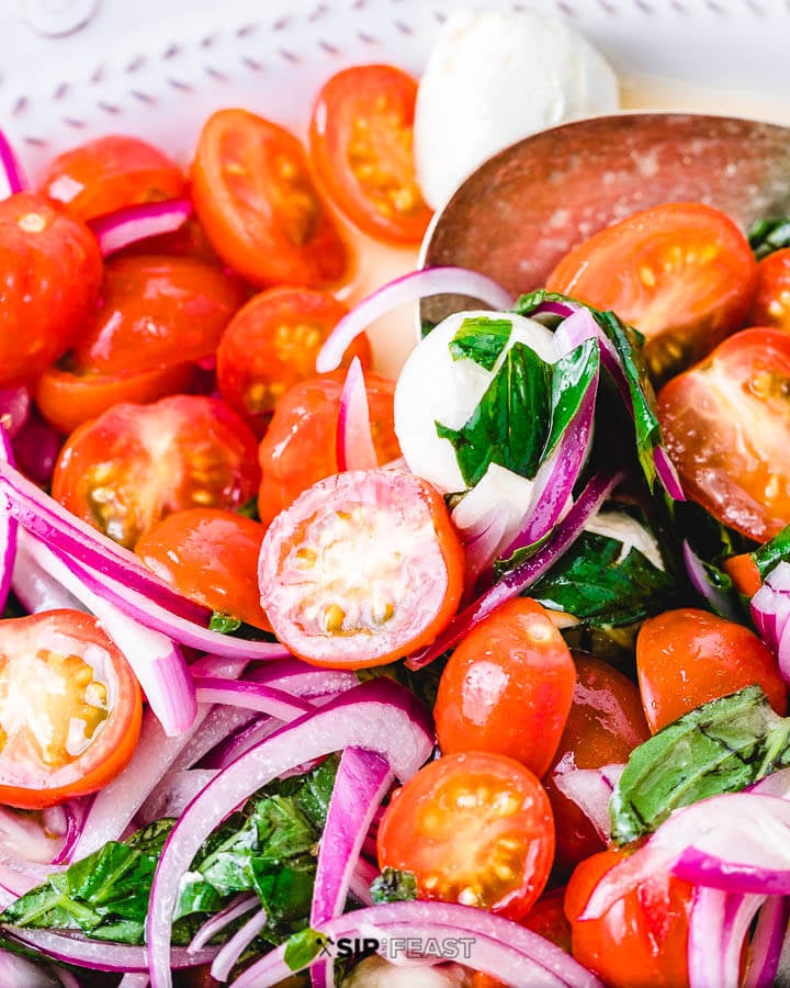 Cherry tomato salad in white plate.