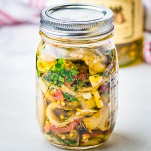 Italian pickled eggplant in glass jar.