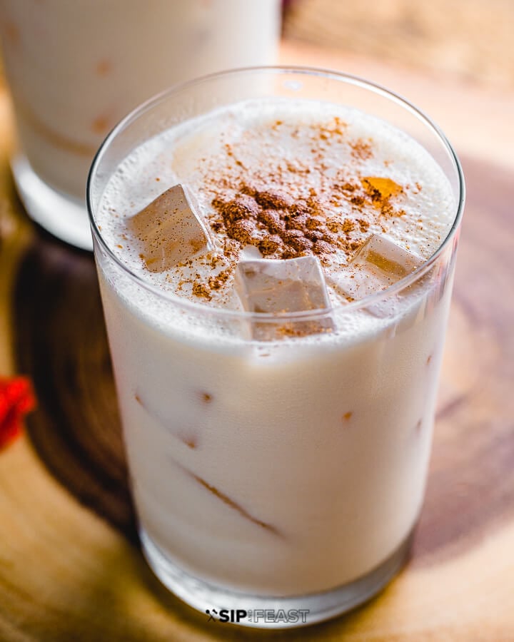 Close up shot of pumpkin spice bourbon milk punch.