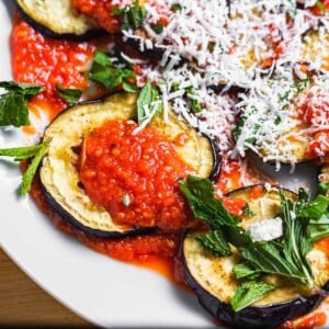 Roasted eggplant with sauce, mint, and ricotta salata featured image.