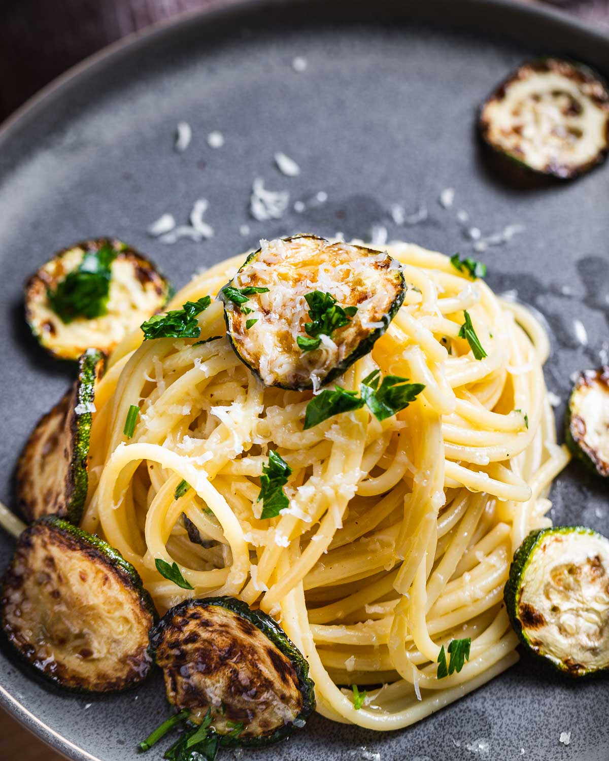 Close up shot of Spaghetti alla Nerano in grey plate.