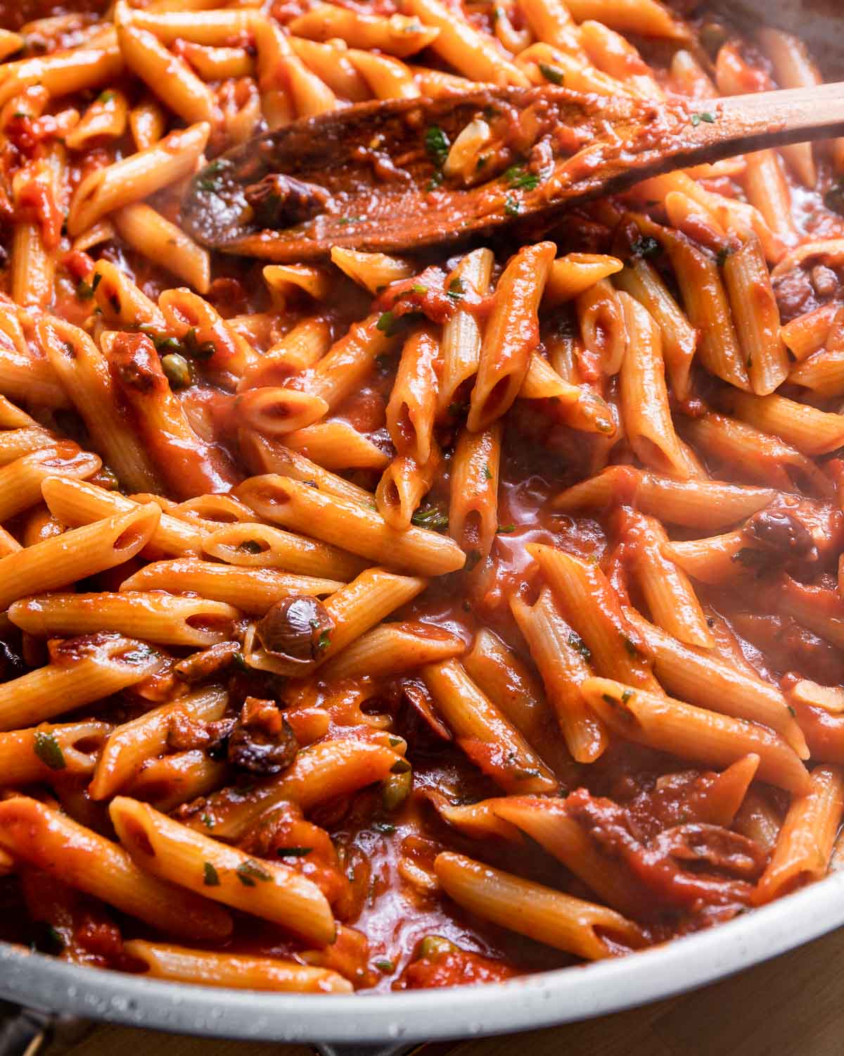 Large pan of pasta puttanesca.