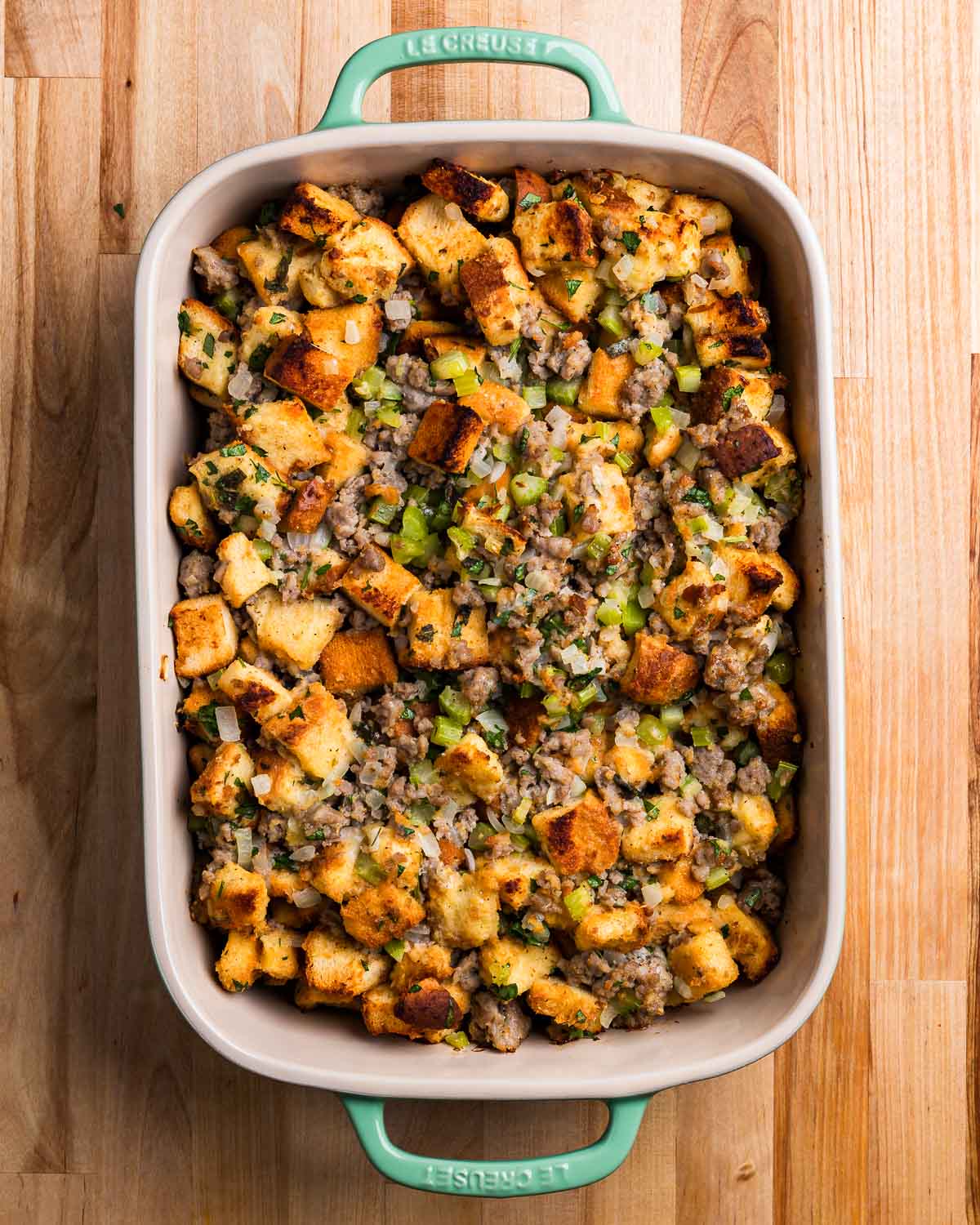 Overhead shot of baking dish with Italian sausage stuffing.