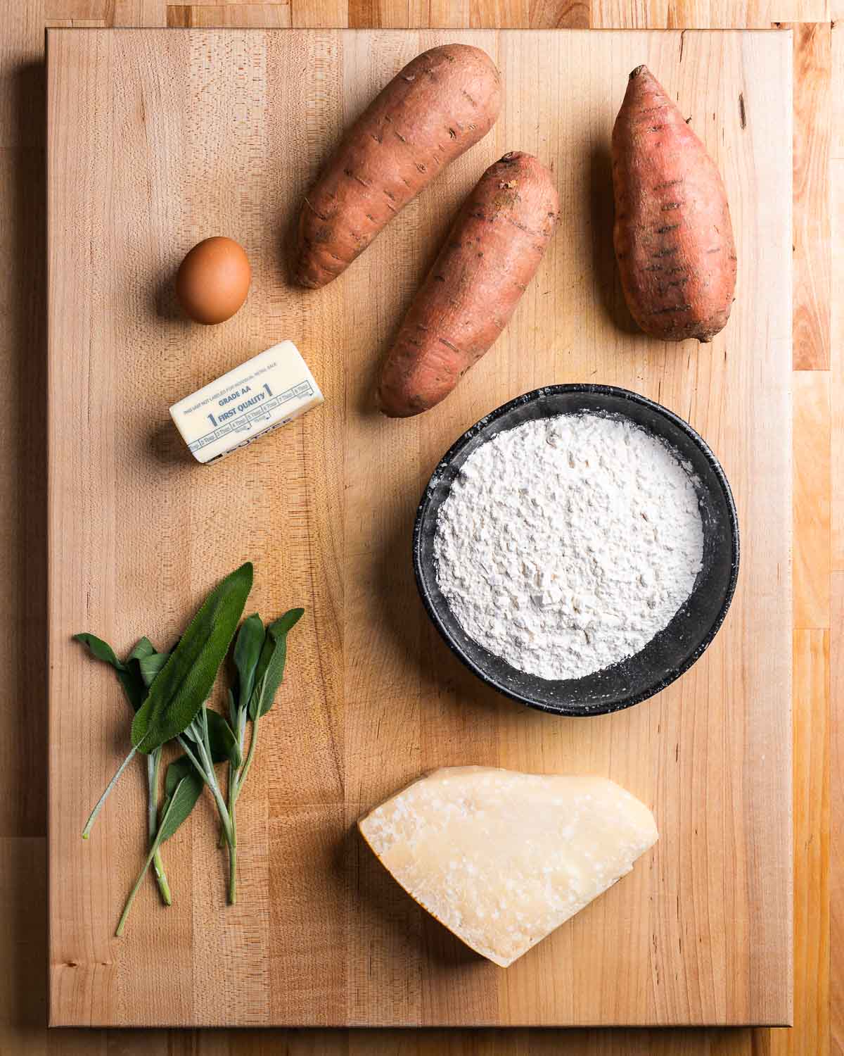 Ingredients shown: sweet potatoes, egg, butter, flour, sage, and parmesan cheese.