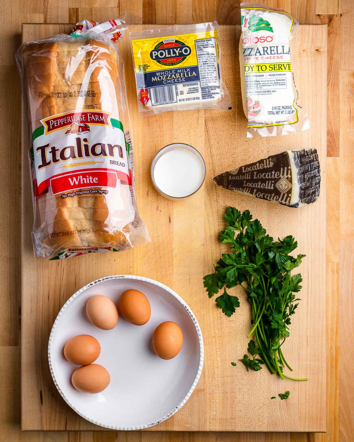 Ingredients shown: Italian style white bread, mozzarella, Pecorino Romano, milk, eggs, and parsley.