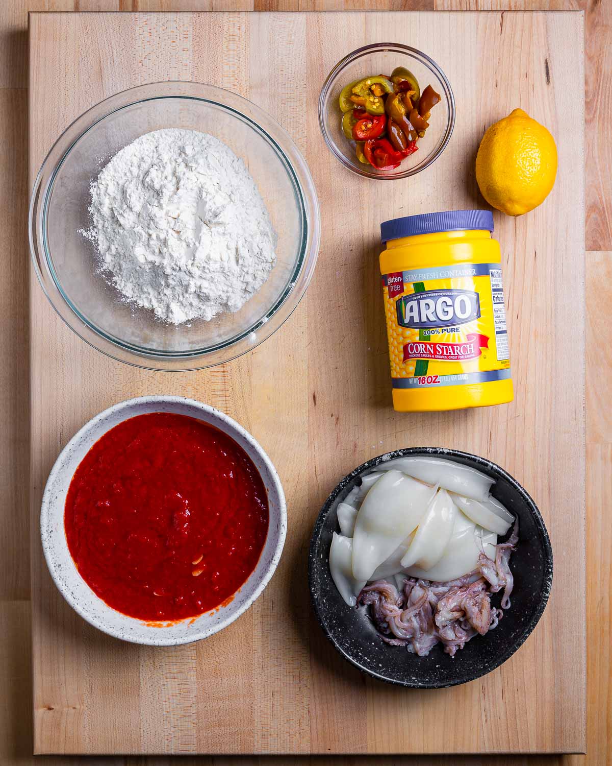 Ingredients shown: flour, cherry peppers, lemon, corn starch, marinara sauce, and calamari.
