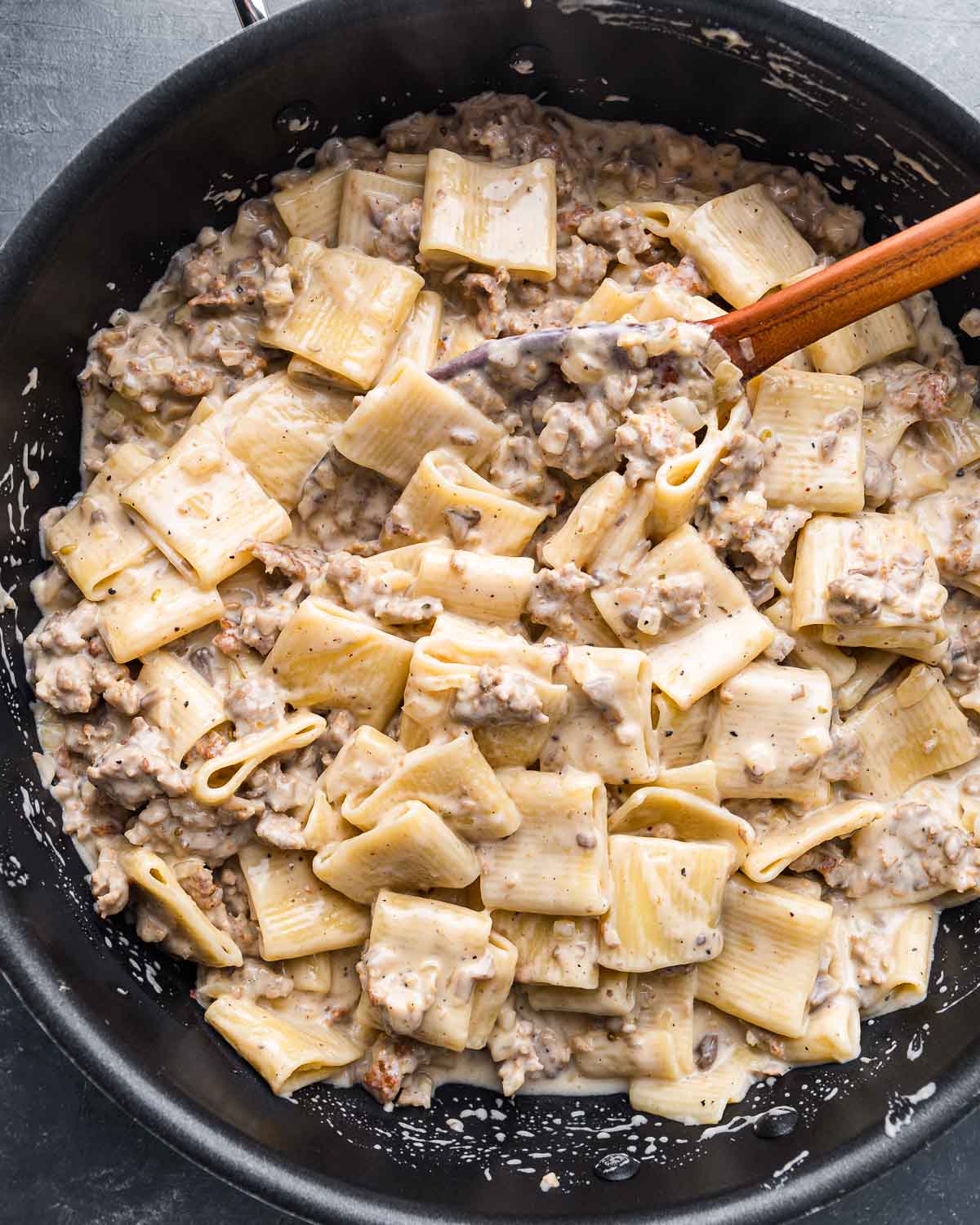 Large black pan with finished pasta alla norcina.