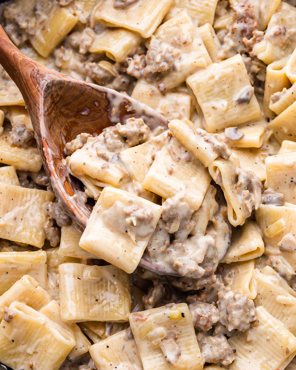 Large wooden spoon with paccheri alla norcina.