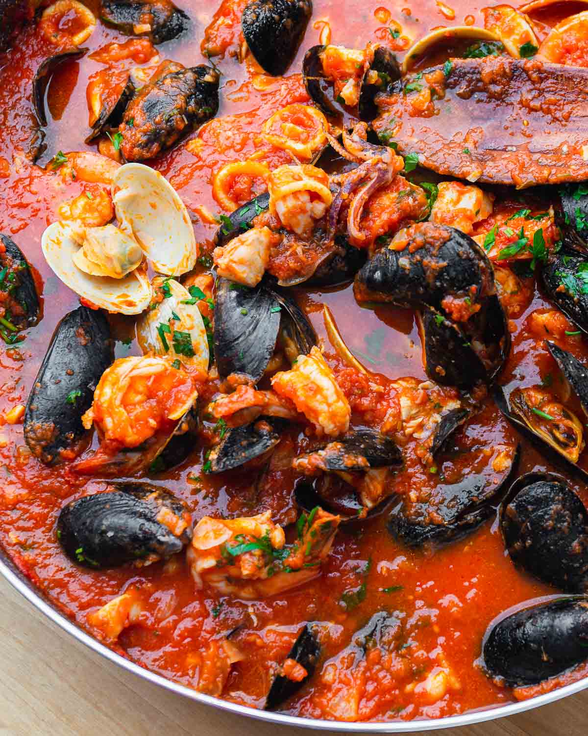 Large pan of cooked zuppa di pesce.