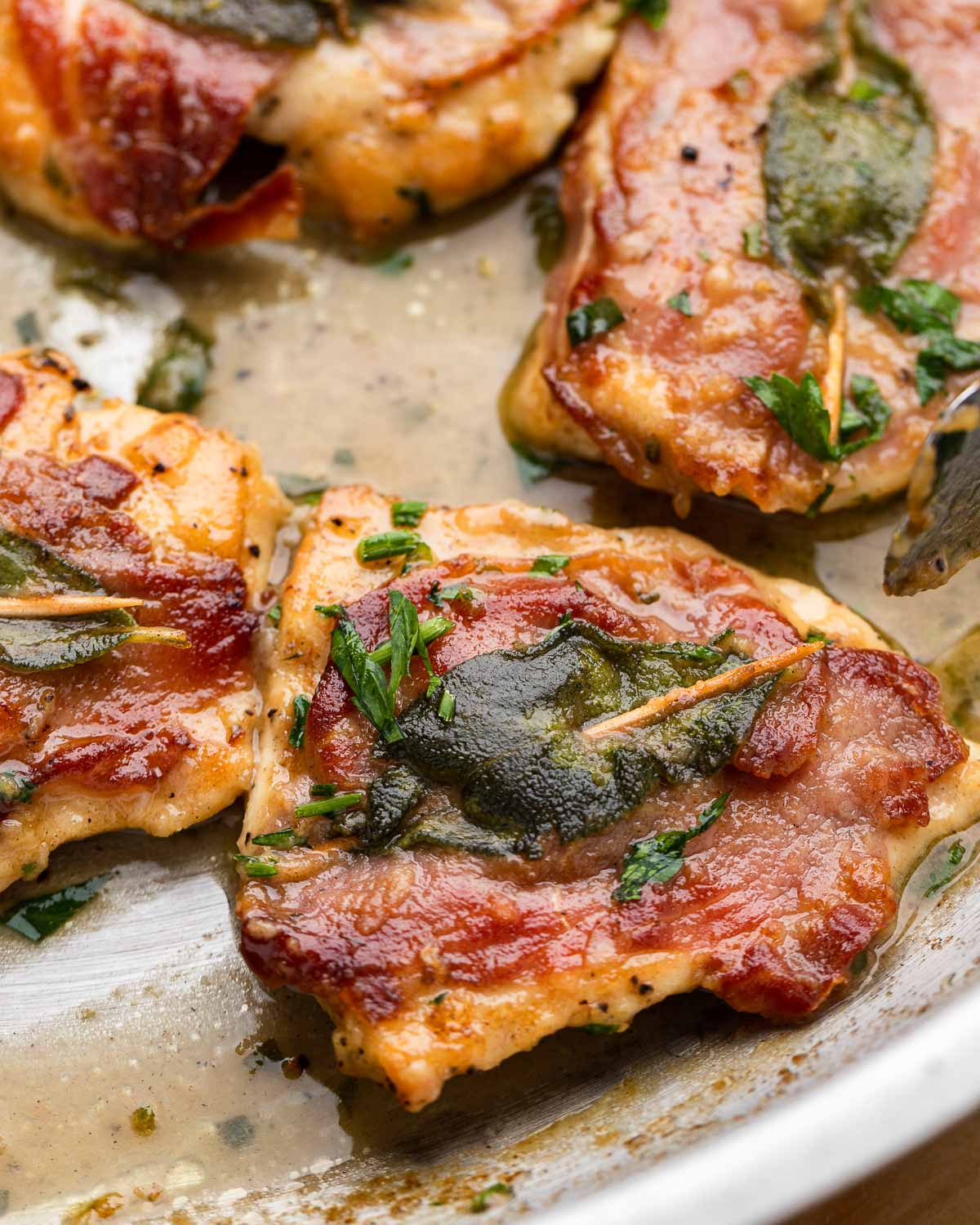 Close up shot of one piece of chicken saltimbocca.