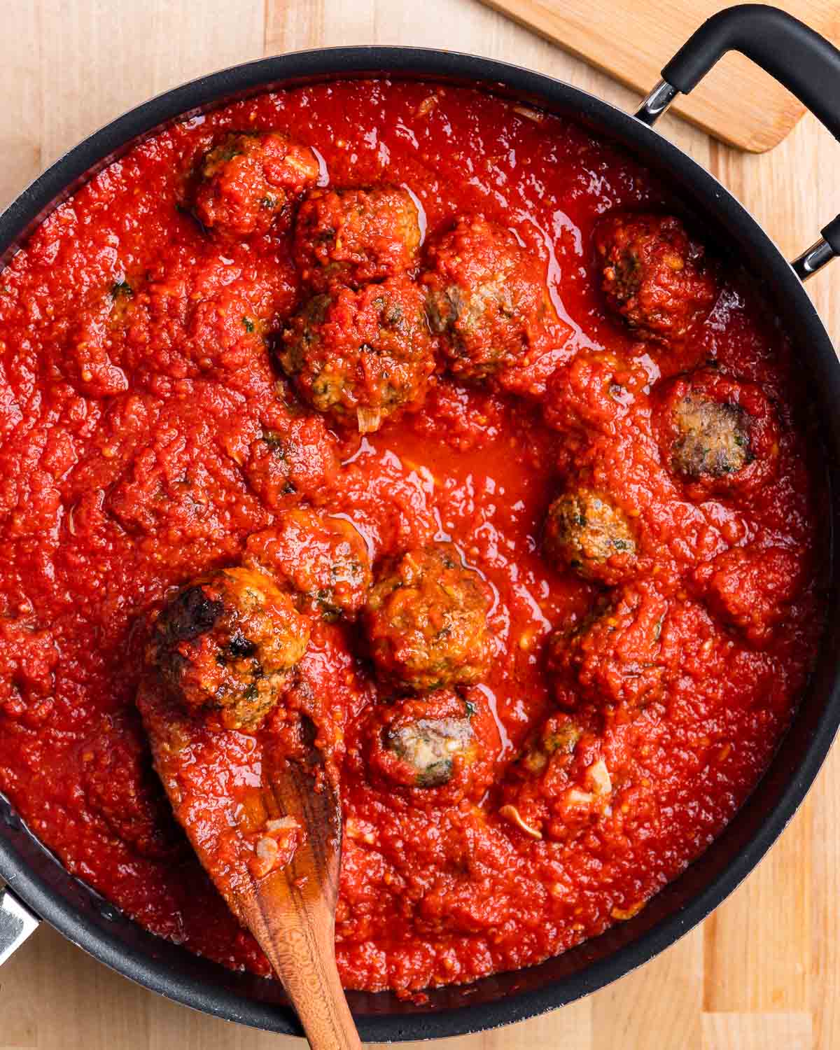 Large pan with meatballs in sauce.