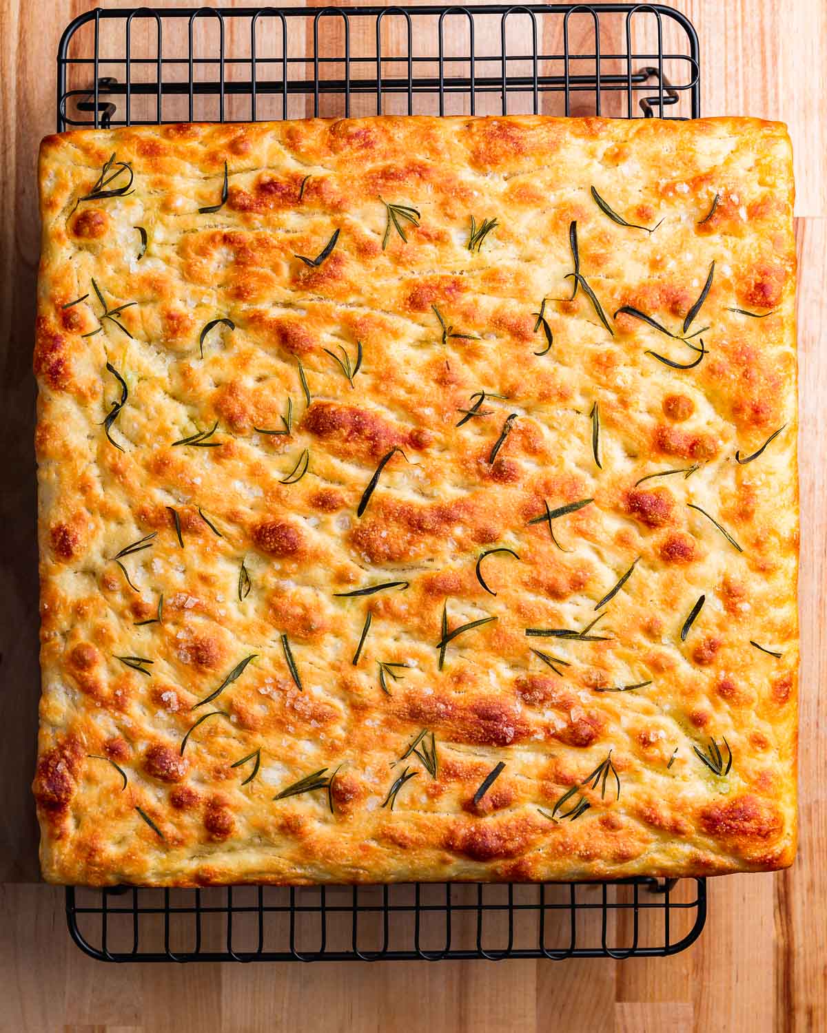 Focaccia on wire rack.