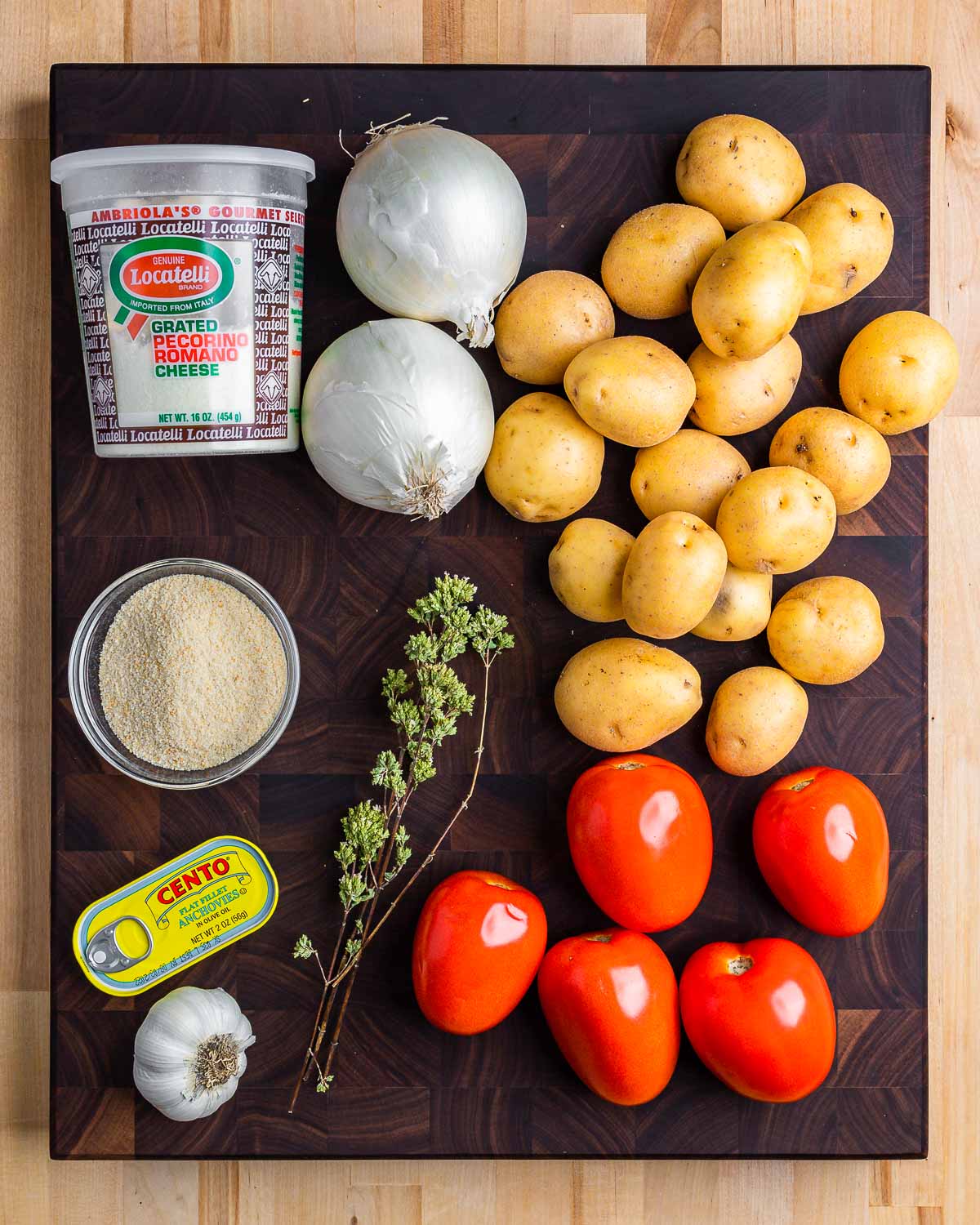 Ingredients shown: Pecorino, onions, potatoes, breadcrumbs, anchovies, garlic, oregano, and tomatoes.