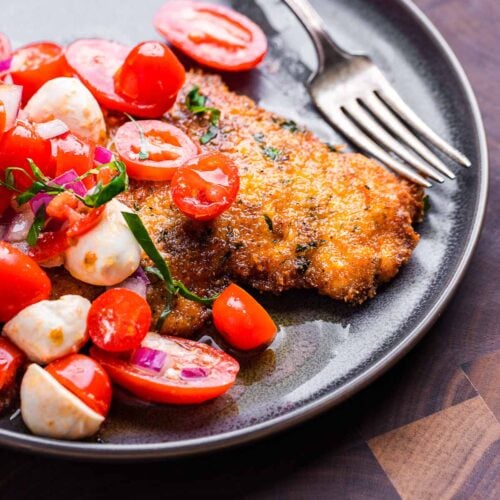 Chicken Milanese with tomato, mozzarella, and basil salad featured image.