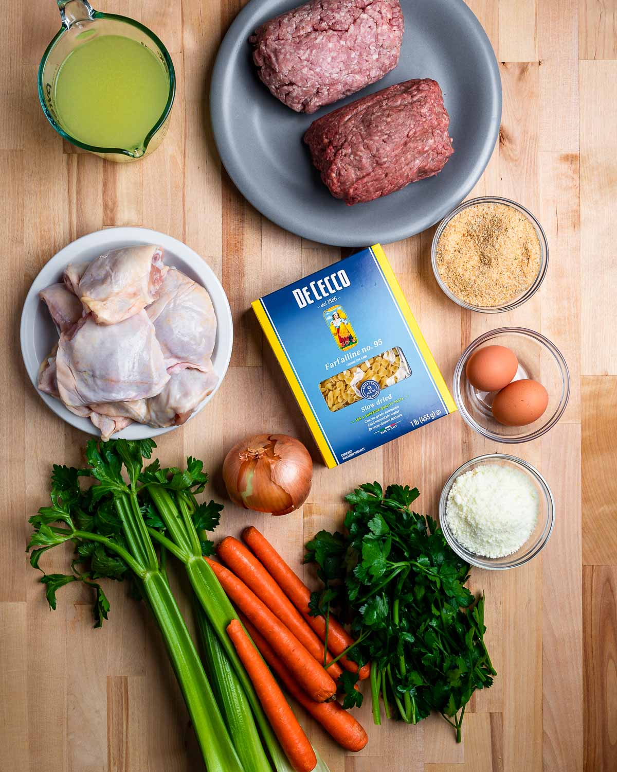 Ingredients shown: chicken stock, ground beef and pork, chicken thighs, veggies, pasta, Pecorino, breadcrumbs, and eggs.