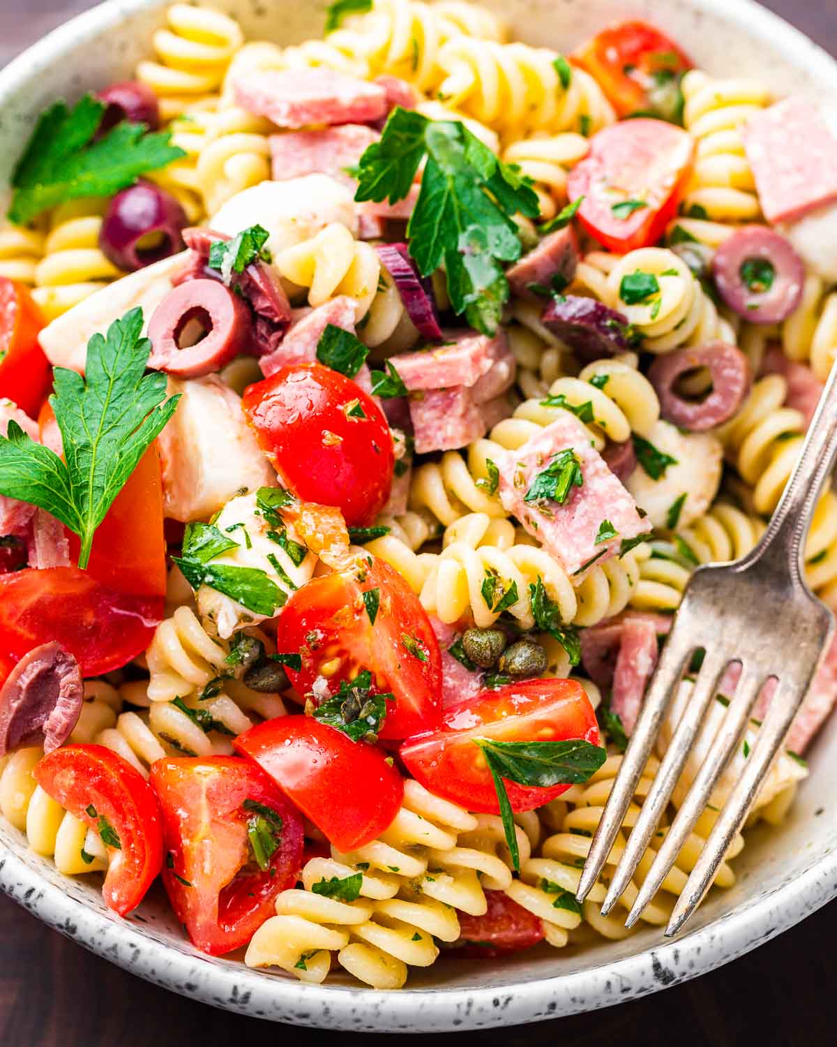 Italian pasta salad in white bowl.