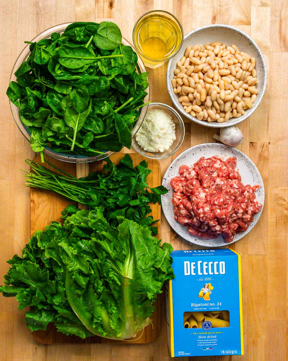 Ingredients shown: spinach, white wine, Pecorino, beans, garlic, sausage, parsley, escarole, and pasta.