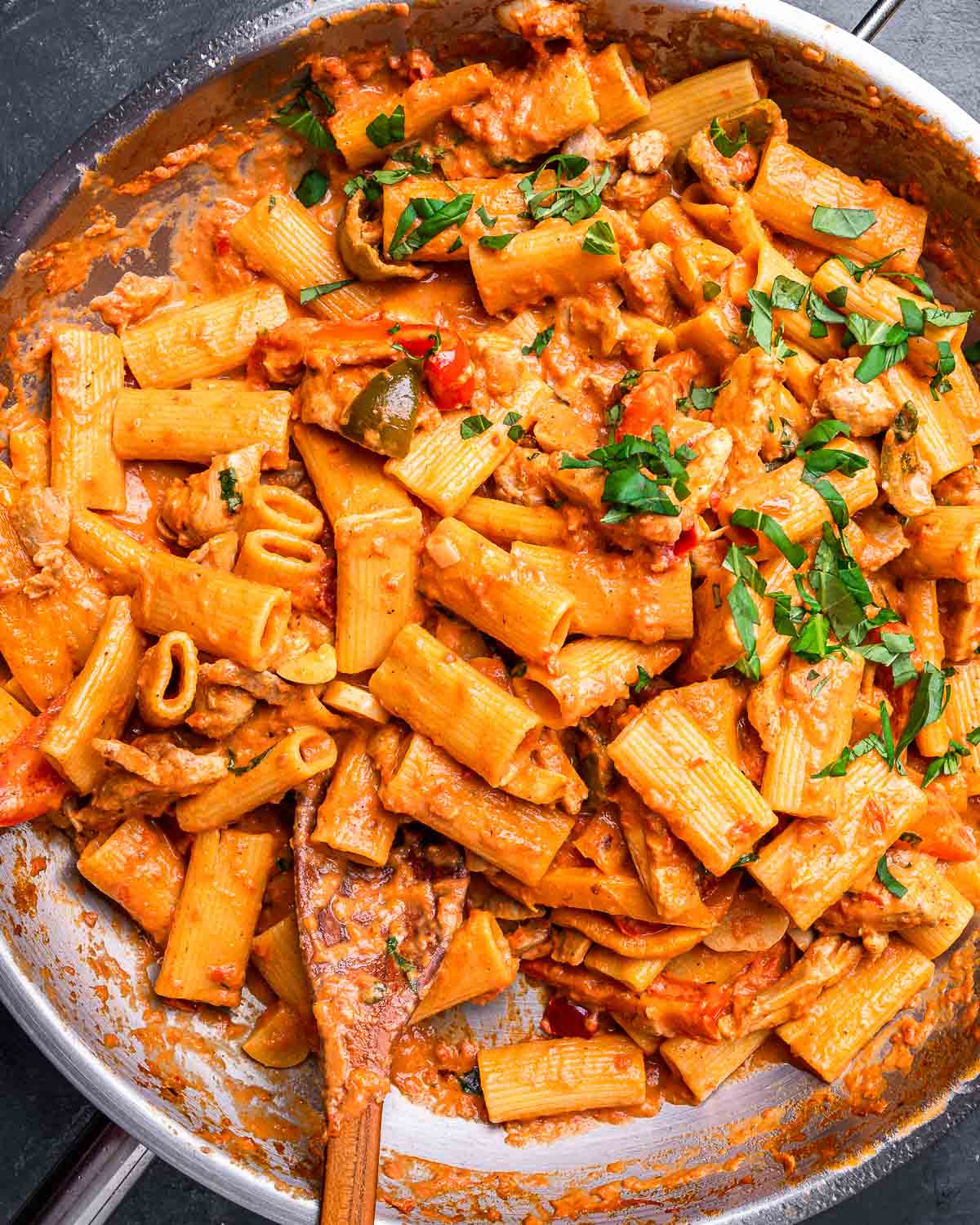 Chicken riggies in stainless steel pan.