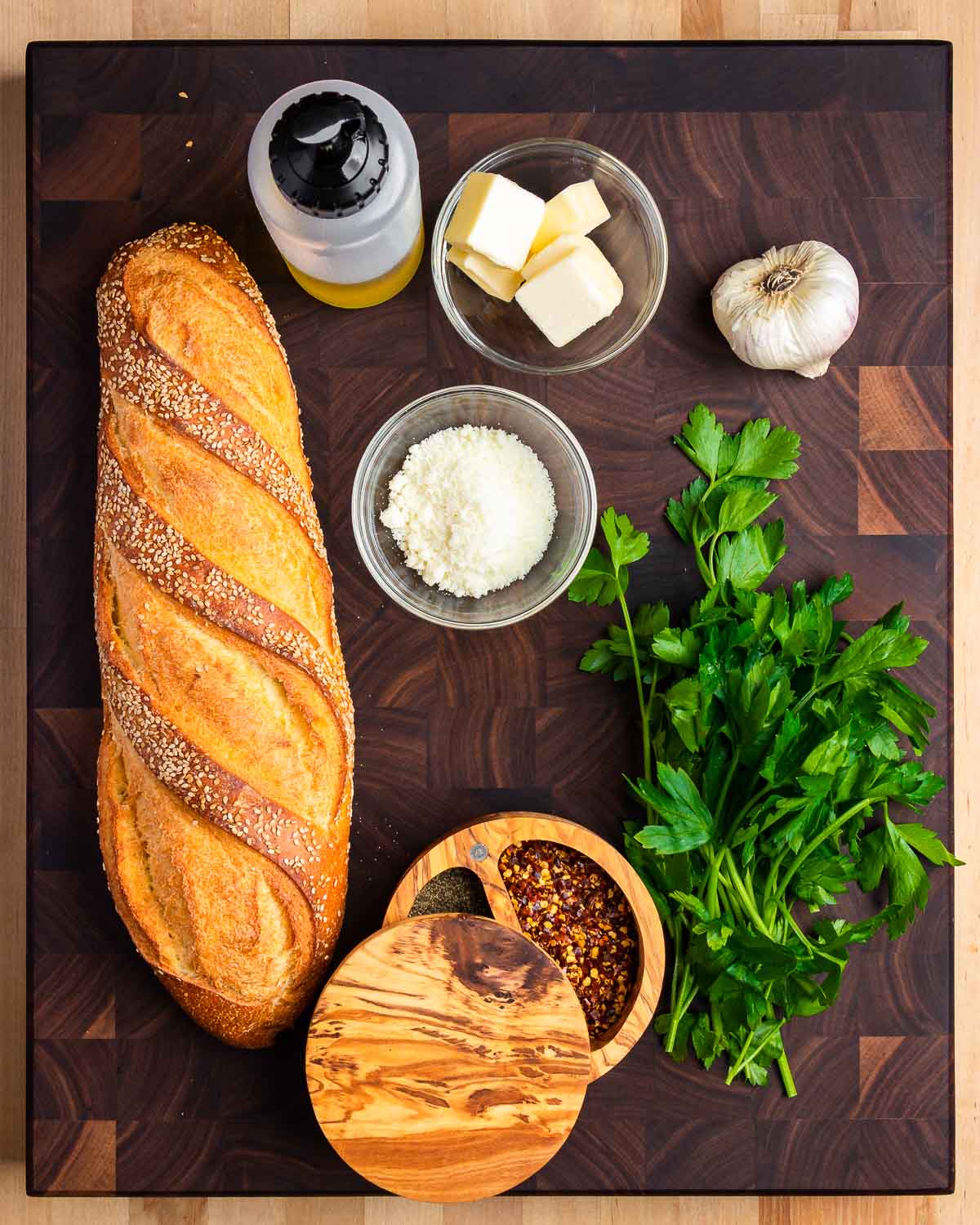 Ingredients shown: Italian bread, olive oil, butter, Pecorino, garlic, pepper, and parsley.