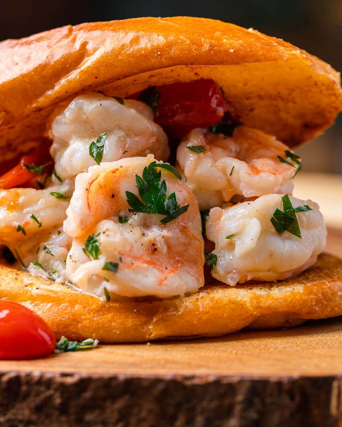 Shrimp scampi roll on wooden board.