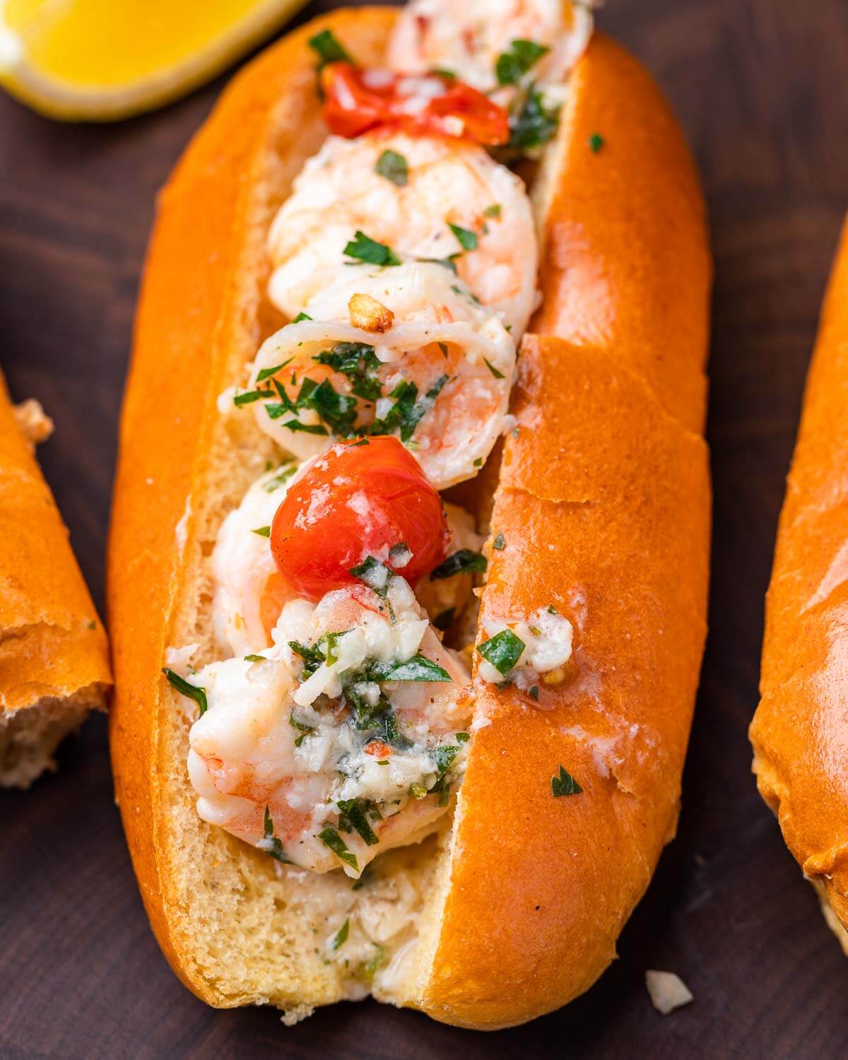 Shrimp scampi roll on cutting board.