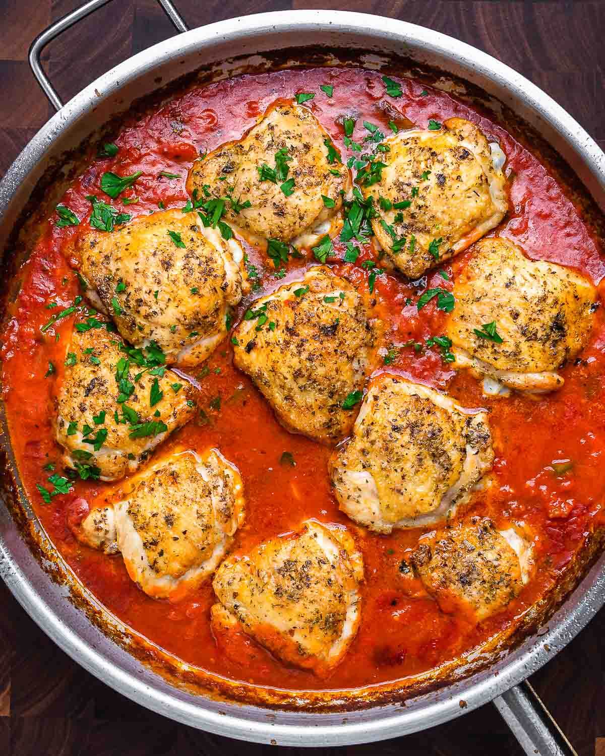 Overhead shot of large pan of chicken fra diavolo.
