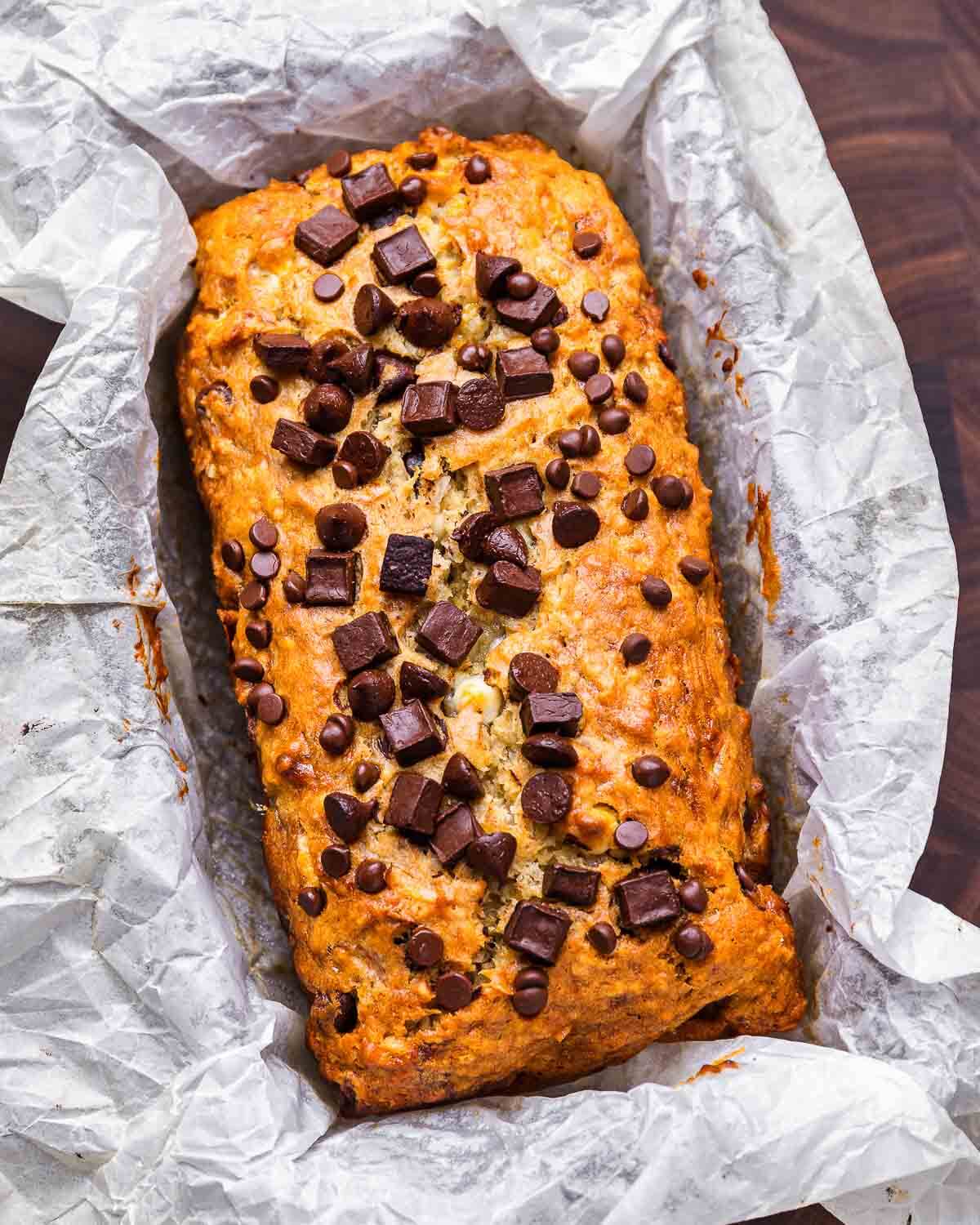 Chocolate chip banana bread wrapped in parchment paper.