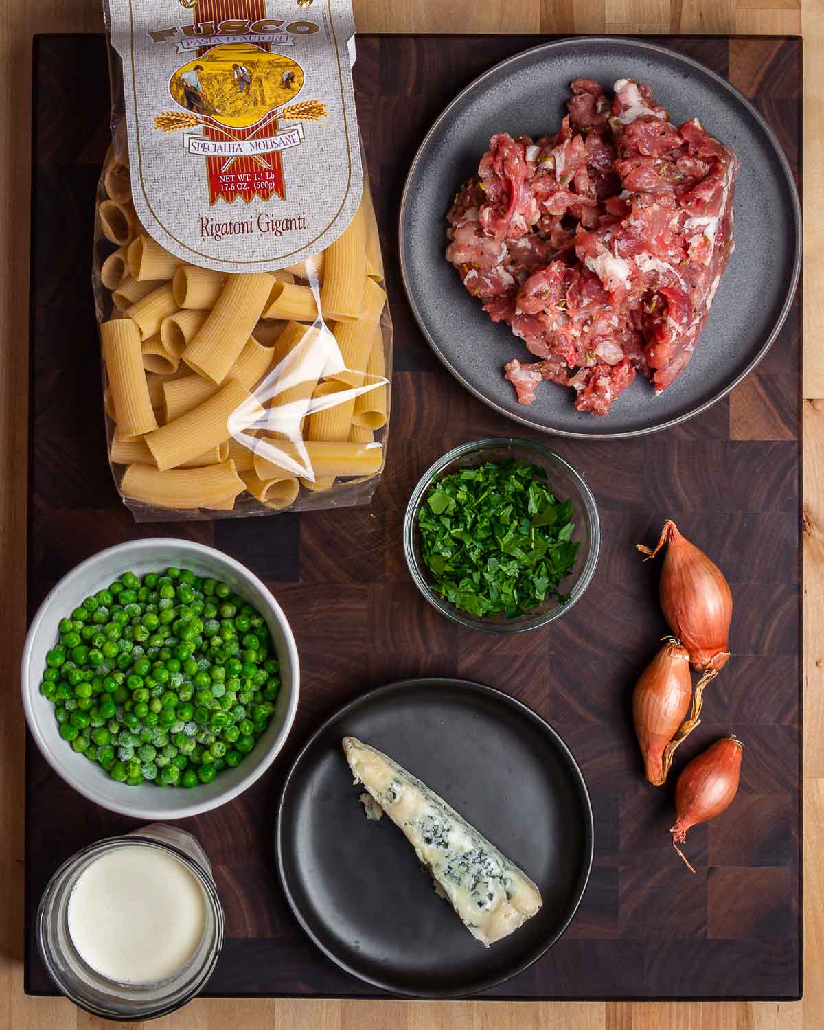 Ingredients shown: rigatoni, Italian sausage, peas, parsley, shallots, gorgonzola, and heavy cream.