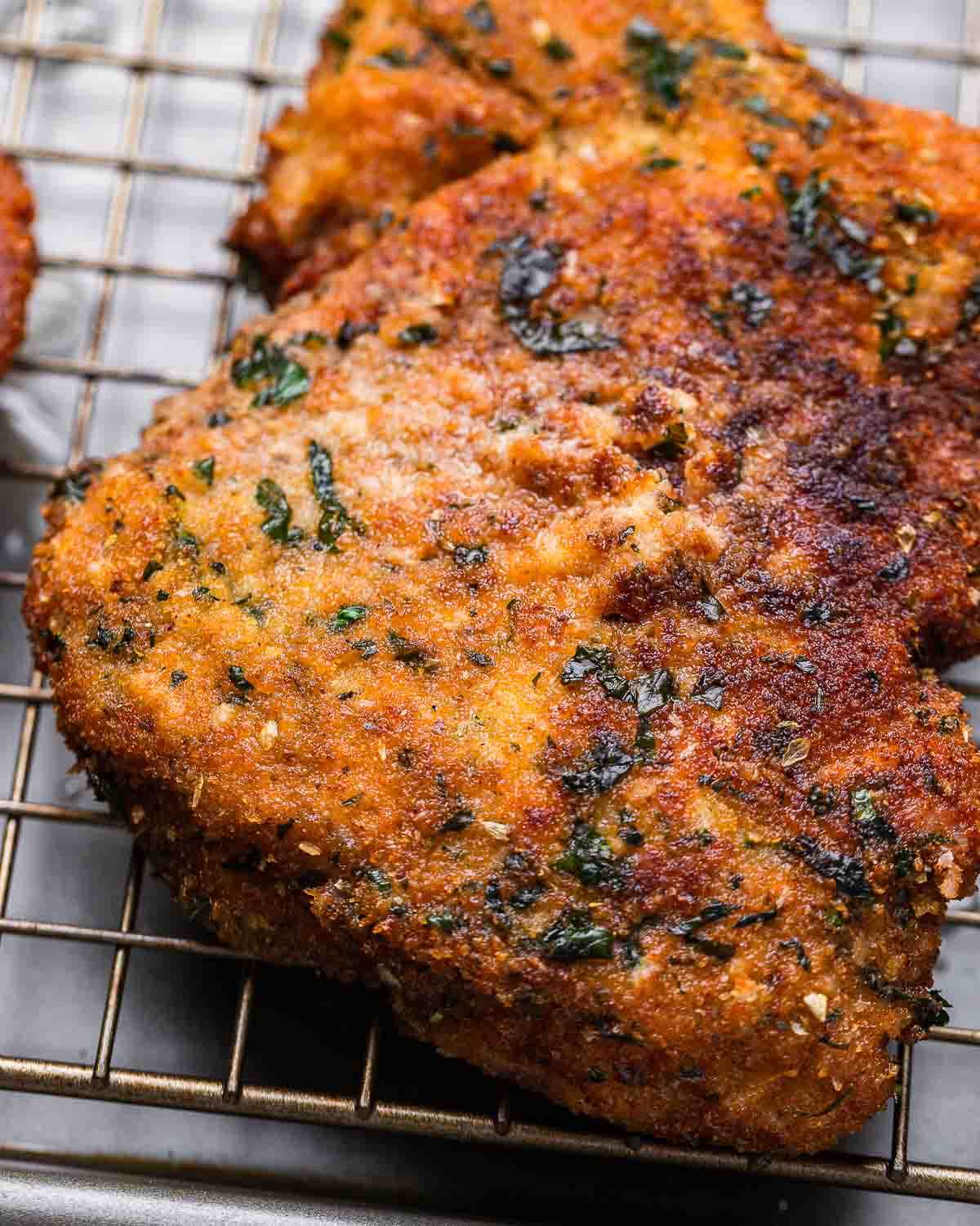 Pork Milanese on wire rack.