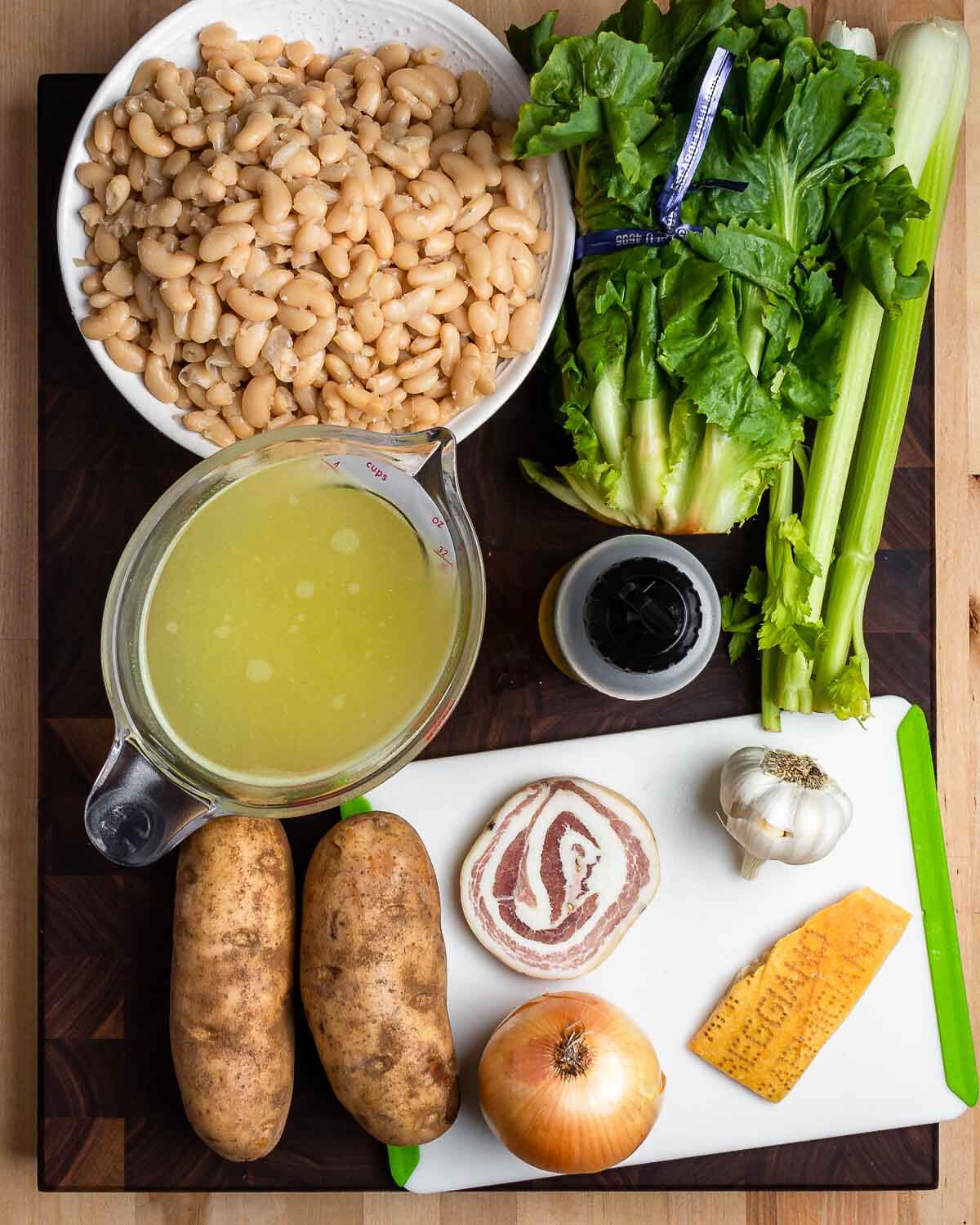 Ingredients shown: cannellini beans, escarole, celery, chicken stock, olive oil, potatoes, pancetta, onion, garlic, and Parmigiano rind.