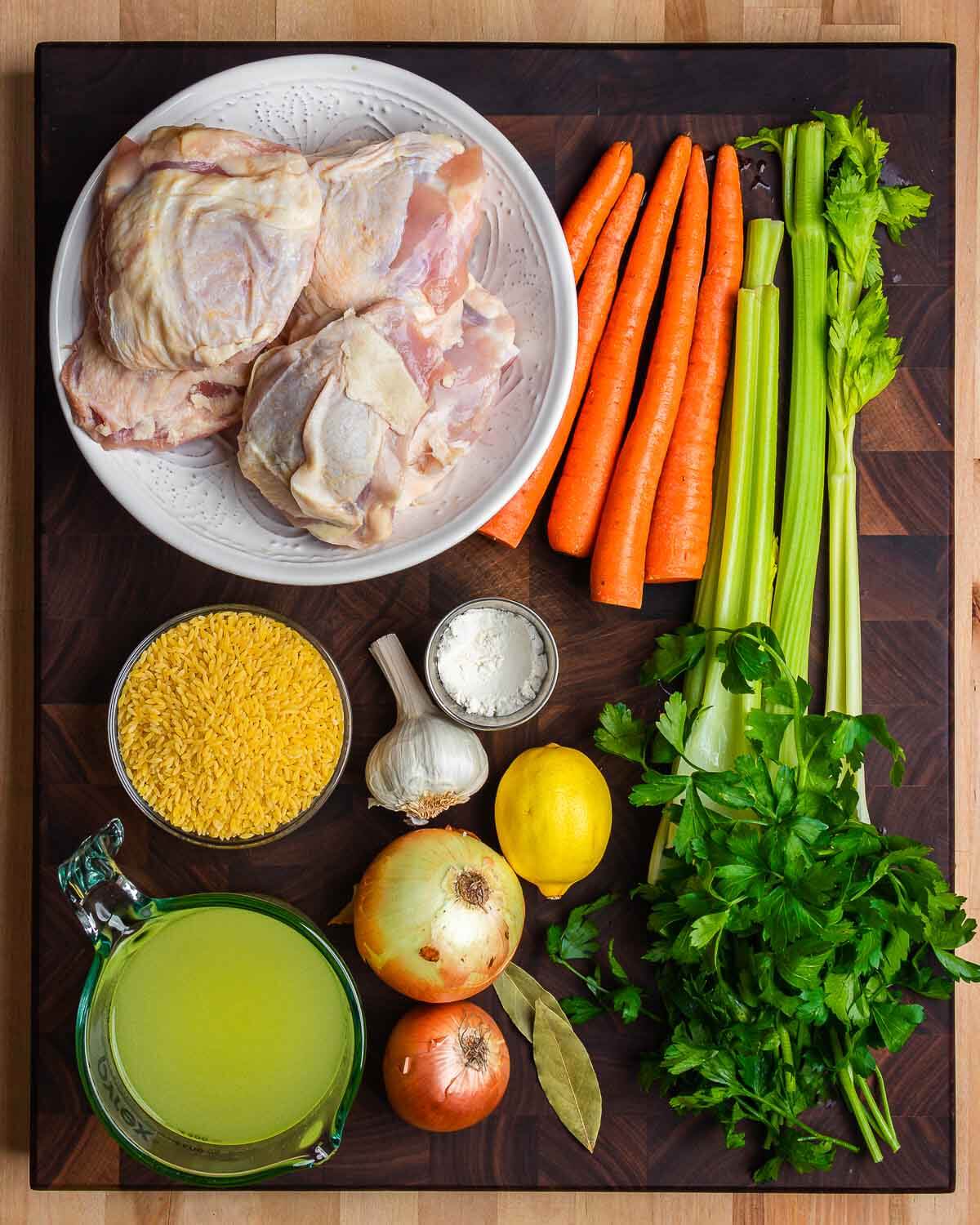 Ingredients shown: chicken thighs, carrots, celery, orzo, onions, chicken stock, lemon, garlic, flour, and parsley.